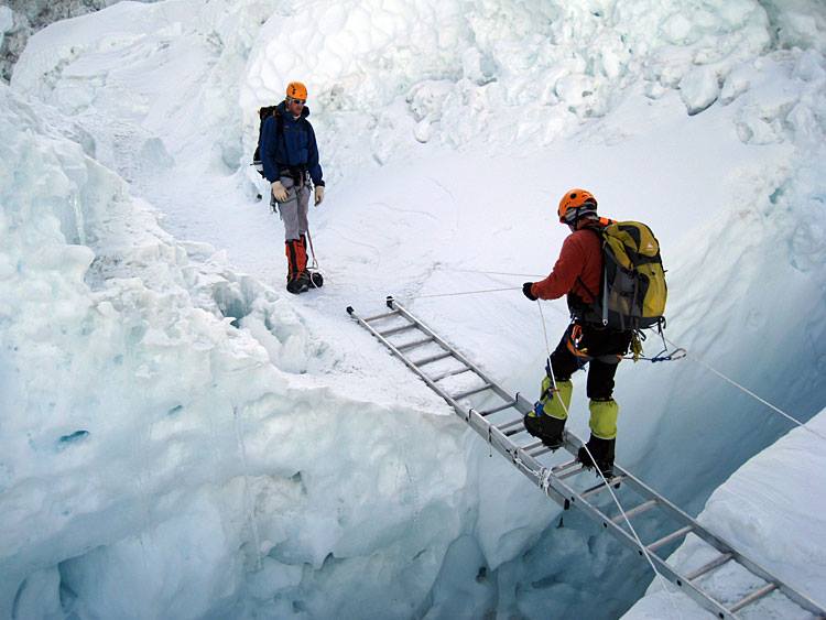 Crossing crevasse in the Khumbu Ice Fall on the South Col Route for Mount Everest