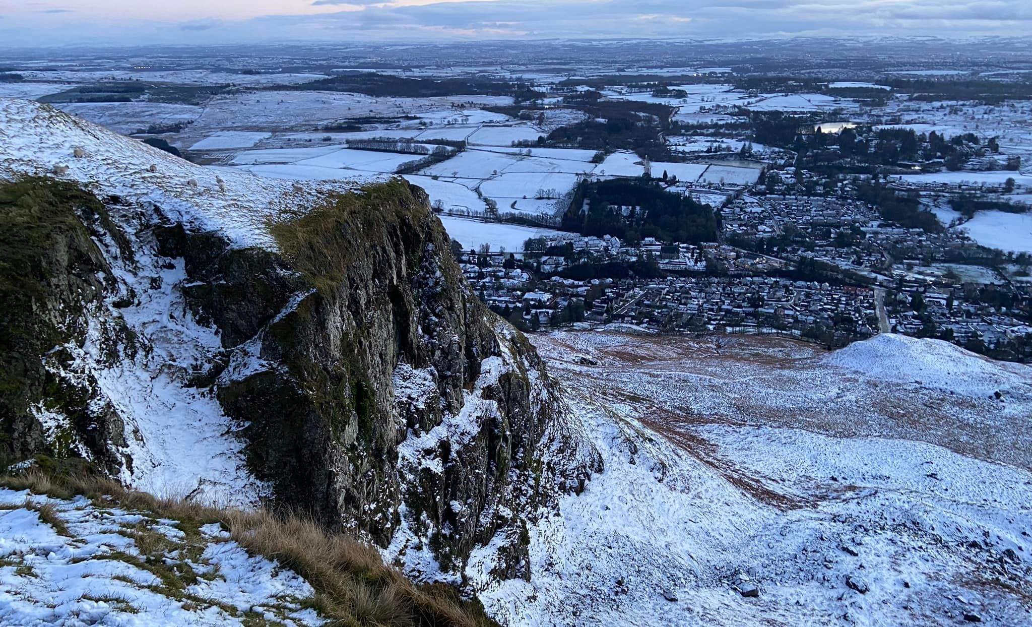 Strathblane beneath the Bannan Crags in the escarpment of the Campsie Fells