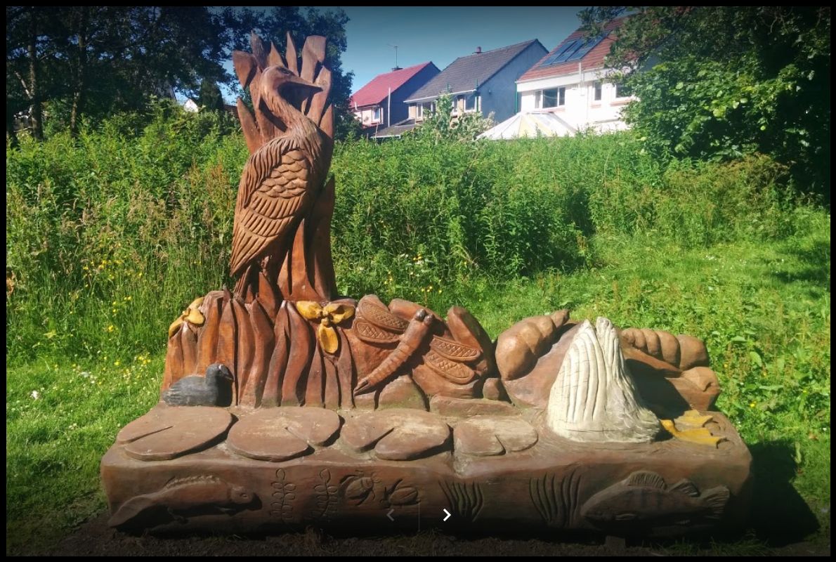 Carved Beech Log Bench at Kilmardinny Loch in Bearsden